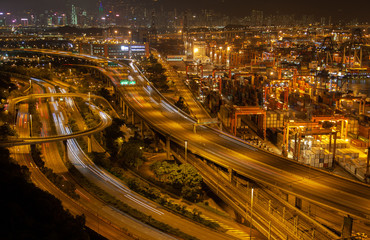 Fototapeta na wymiar Container port Hong Kong overpass road near modern harbour cranes