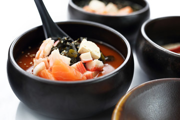 Fish Japan soup. Fish broth with salmon, crab sticks and algae.