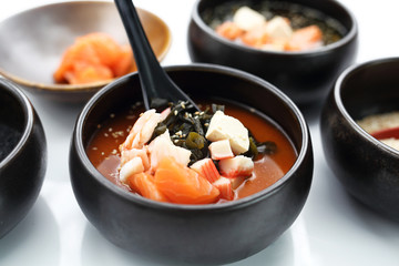  Fish Japan soup. Fish broth with salmon, crab sticks and algae.