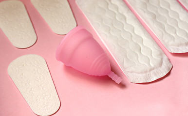 Sanitary pad, menstrual cup on pink background