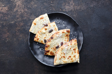 Indian naan baked in a tandoori oven, an addition to Indian cuisine. Traditional Indian cuisine, Indian cuisine.