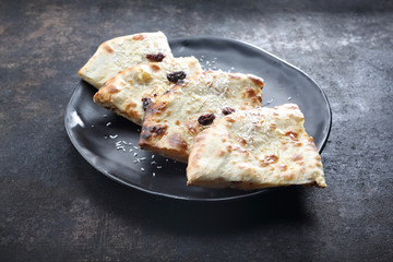Indian naan baked in a tandoori oven, an addition to Indian cuisine. Traditional Indian cuisine,...
