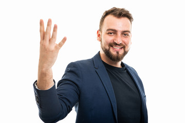 Business man wearing smart casual clothes showing number four