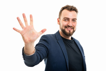 Business man wearing smart casual clothes showing number five