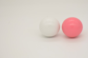 two small balls on a white background
