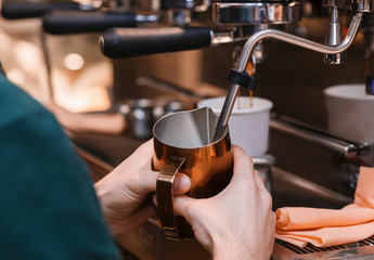 Fototapeta na wymiar Male Hands Making Coffee Drink Using Coffee-Machine In Cafeteria