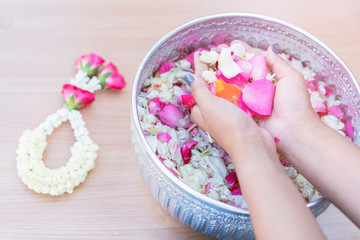 Thai people celebrate Songkran the new year water festival by giving garlands to their seniors and asked for blessings
