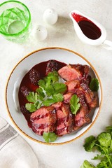 Duck breast in blackberry sauce. Homemade organic food.