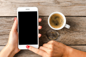 Woman using smartphone with empty black screen.