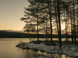 Fototapeta na wymiar landscape with early sunrise by the lake, heaven sky, black tree silhouettes.