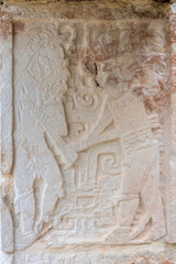 Traditional Mayan symbols. Fragment of palace of the Masks (Codz Poop) in Kabah Mayan archaeological site. Yucatan. Mexico.