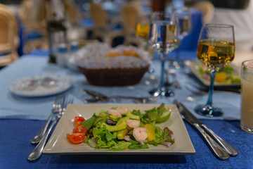 Healthy Salad with Avocado and Shrimp on the Table