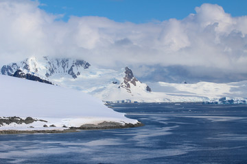 Fototapeta na wymiar Mountains of the Antarctic Peninsula. The mountains in the Gerlache Strait in the Danco Coast, Antarctica
