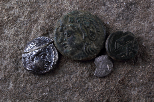 Ancient Greek silver coin with Apollo, little silver coin with Athena, copper coin with satyr and little coin