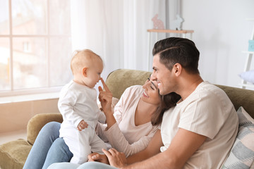 Fototapeta premium Cute baby with parents at home