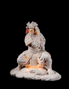 Ceramic garden decoration, lantern in the shape of a Japanese medieval warrior (samurai) copy of netsuke