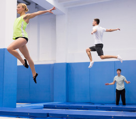 Woman exercising on trampoline
