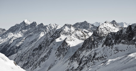 Fototapeta na wymiar Alpine winter wonderland in Europe. Mountains in Austria in the Alps of Tyrol. Glacier Stubaier Gletscher. Iconic scenery