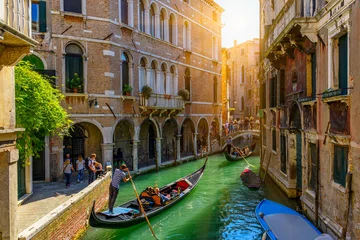 Door stickers Gondolas Narrow canal with gondola and bridge in Venice, Italy. Architecture and landmark of Venice. Cozy cityscape of Venice.