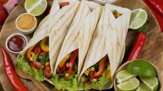 Traditional Mexican Delicious Buritos Made of Tortillas with Filling. Close up. Mexican Food