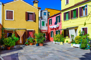 Fototapeta na wymiar Street with colorful buildings in Burano island, Venice, Italy. Architecture and landmarks of Venice, Venice postcard