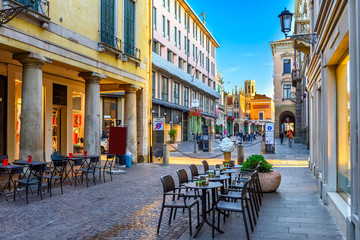 Old street with tables of pizzeria in Padua (Padova), Veneto, Italy