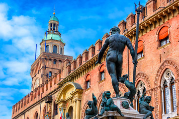 The Fountain of Neptune (Fontana di Nettuno) with Palazzo d'Accursio in background in Bologna, Italy. Architecture and landmark of Bologna. Cityscape of Bologna. © Ekaterina Belova
