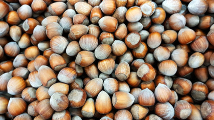 Hazelnuts food background texture.