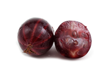 Black-violet gooseberry with a half