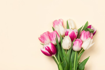 Bouquet of tulips in pink and white colors. Concept of spring, Women's Day, Mother's Day, 8 March, the holiday greetings. Copy space, flat lay.