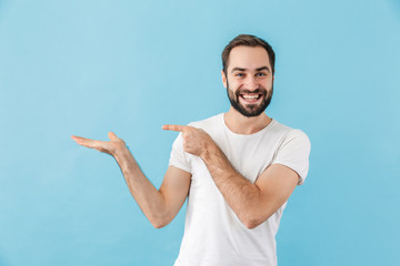 Portrait of a young cheerful bearded man wearing t-shirt