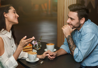 Boyfriend And Girlfriend Talking And Having Coffee Drinks In Cafeteria