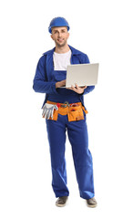 Handsome male worker with laptop on white background