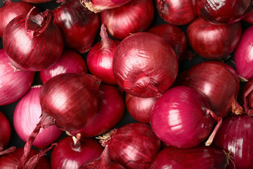 Many raw onions as background