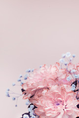 flowers, close-up of pink, pale pink chrysanthemums and small lilac flowers, bouquet composition. vertical photo. copy space