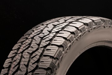 matador izzarda at 2-all-season off-road tires all terrain, sidewall close -up on a dark background