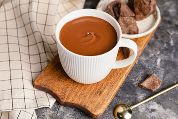 Cup of hot chocolate on grunge background
