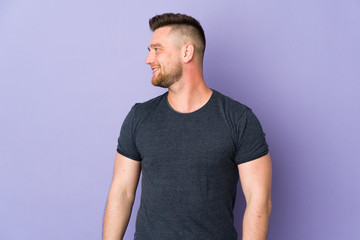 Russian handsome man over isolated background looking side