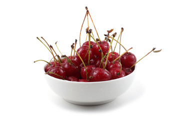 Red cherries on dish