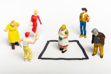 Woman separated in a special area surrounded by other people