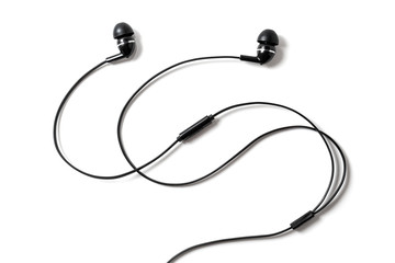 Vacuum black wired earplugs for listening to music and sound on portable devices isolated on a...