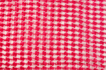 Traditional tissue red and white arabic man's head scarf Shemagh (Keffiyeh). Saudi men’s national headdress Ghutrah. Close up textile background.