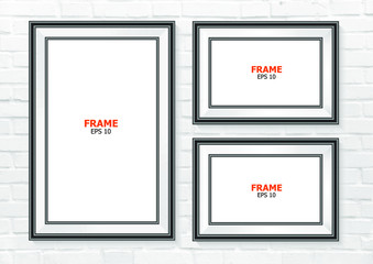 Black photo frame and Vertical frame on brick wall