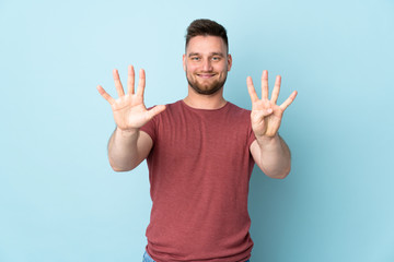 Russian handsome man over isolated background counting nine with fingers