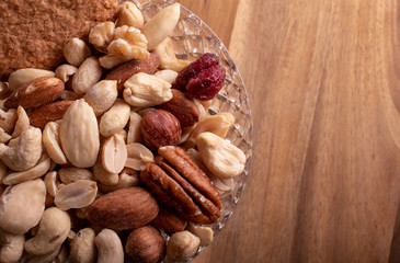 Walnut kernels peanuts hazelnuts in a glass vase. Healthy eating. Diet.