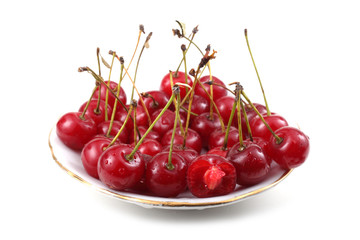 Red cherries on dish