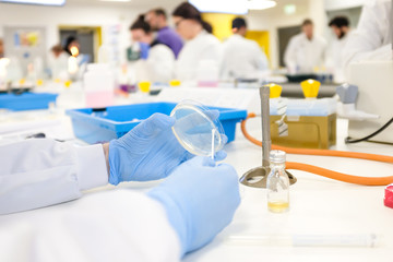 Health care researcher working in life science laboratory. Scientist preparing and analyzing slides and doing research in research lab.