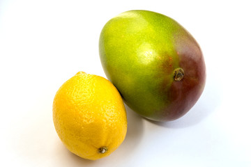 Mango, lemon on a white background, isolated, close-up, space for text