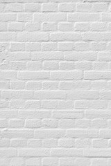 White painted brick wall with some relief background texture