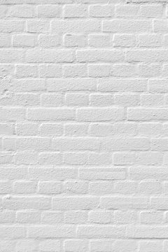 White painted brick wall with some relief background texture